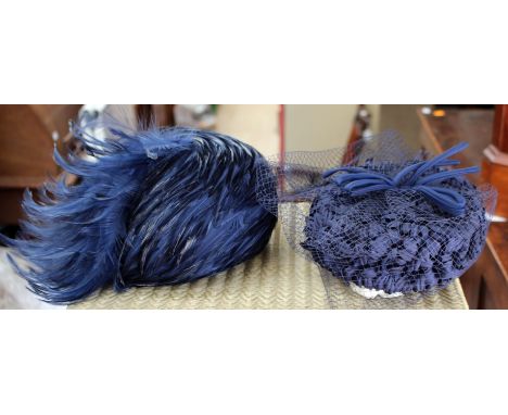 Two hats, both 1970s to include one feather cloche shape in good condition and a straw navy pill box with a veil 