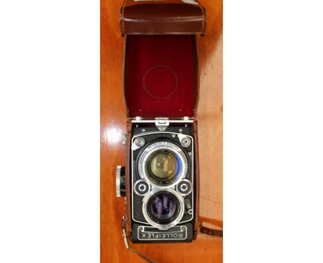 A Rollaflex camera, cased