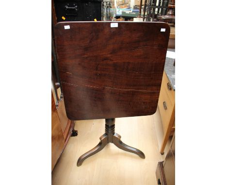 A mid 19th Century mahogany tilt-top tripod table, raised on a turned support, standing on shaped legs