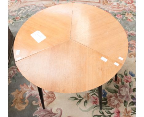 A nest of three Ercol style tables, each segment fitting together to form a circular coffee table, circa 1950s, approx. 52cm 