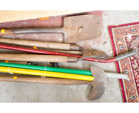 A collection of gardening tools, including pitch fork, rake, axe, plus bedroom chair, etc (Q)