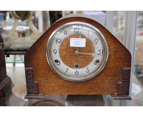 An Art Deco mantle clock domed veneer case