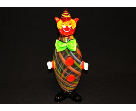 A Murano glass clown, red hat, green bow tie, striped body, 35cm high