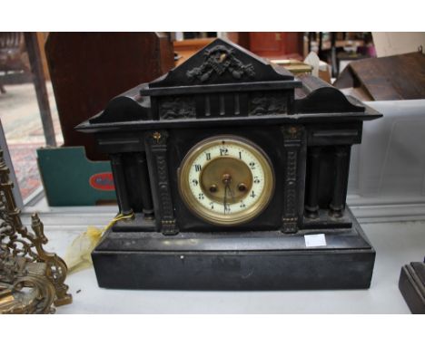 A Victorian black slate mantle clock, eight day movement, with a white enamelled dial and Arabric numerals