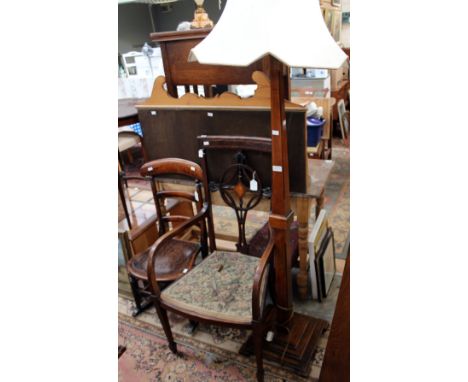 An oak coffee table, an Edwardian rocking chair, an Edwardian open armchair, together with a standard lamp, (4)