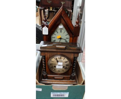 A late 19th century American rosewood veneered mantle clock, together with an early 20th century oak mantle clock, both with 