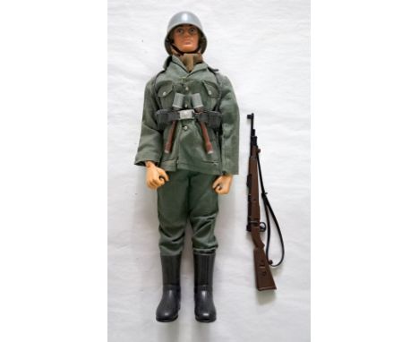 Palitoy Action Man German Stormtrooper, blonde flock hair, blue pants, eagle-eyes, gripping hands, wearing helmet, jacket, tr