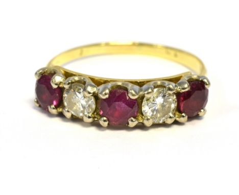 RUBY &amp; DIAMOND ETERNITY RING  Set in 18ct gold with good quality round cut rubies, estimated to total 1.00 carat, flanked