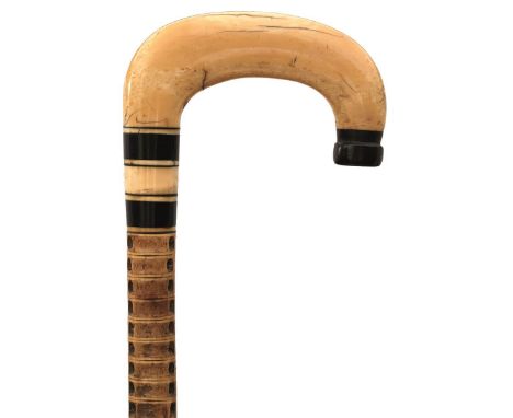 A 19TH CENTURY MARINE VERTEBRAE WALKING STICK, with marine ivory and horn crook handle, vertebrae haft, metal ferrule, 87.5cm