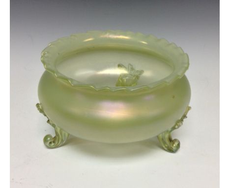 An early 20th century Loetz style green opal glass bowl, three feet, flared rim, 16cm diam