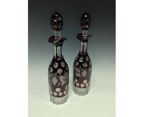 A pair of Bohemian ruby decanters, engraved with fruiting vine, 35.5cm high, c.1880