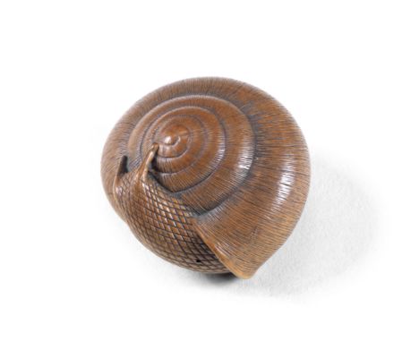 A wood netsuke of a snailBy Tadayuki, Nagoya, Edo period (1615-1868), early 19th centuryThe snail emerging from its shell, it