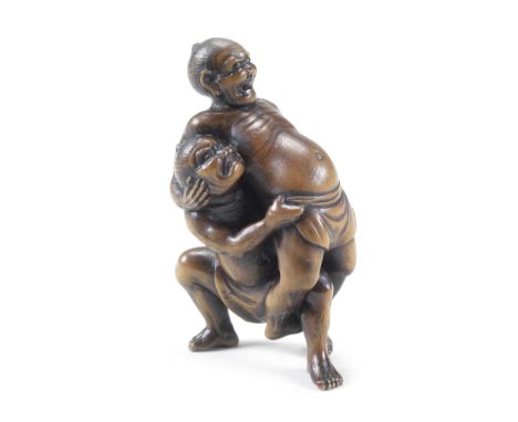 A large boxwood netsuke of two sumo wrestlersBy Unhodo Masayoshi, Meiji era (1816-1912), circa 1890Possibly Kawazu Sukeyasu a