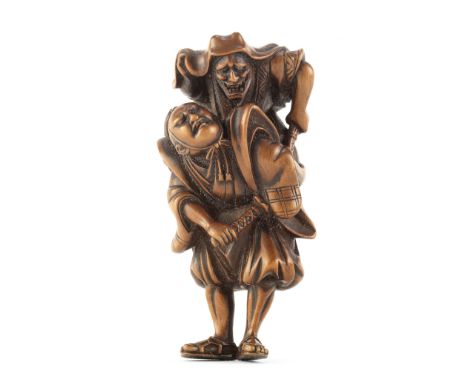 A wood netsuke of Omori Hikoshichi and ChihayaEdo period (1615-1868), late 18th/early 19th centuryThe warrior standing and be