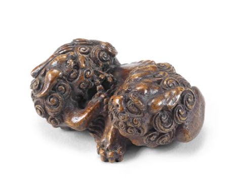 A bamboo netsuke group of two shishi (Chinese mythological lion dogs)Meiji era (1868-1912), late 19th/early 20th centuryThe a