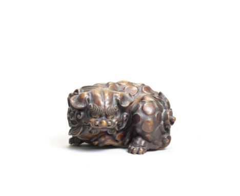 A large wood mokugyo (Buddhist liturgical gong) in the form of a shishi (Chinese mythological lion dog)Meiji era (1868-1912),