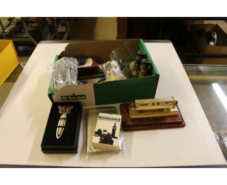 A box of various sundries to include opera glasses, table lighter, desk calendar etc.