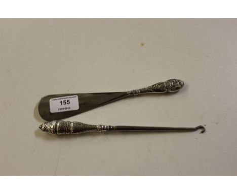 A silver handled shoe horn; and a silver handled button hook 
