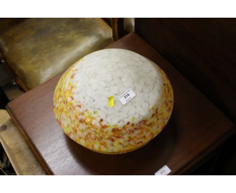 A mottled glass light shade