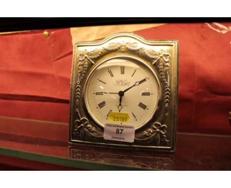 A modern silver cased mantel clock 