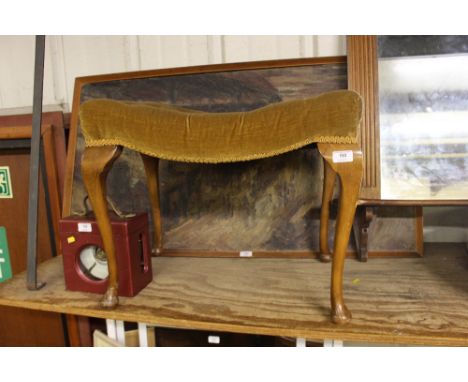 A button down dressing stool raised on cabriole supports
