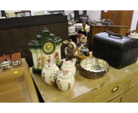 Three ginger jars and covers; a porcelain cased mantel clock; a novelty table lamp; a silver plated and glass lined fruit bow