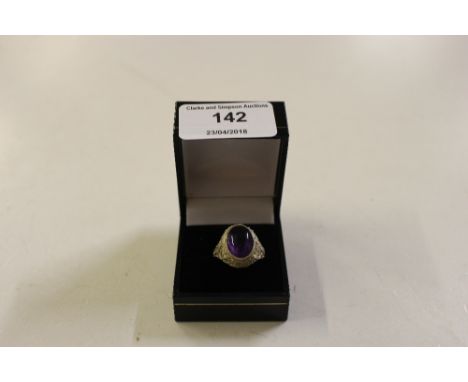 An amethyst and silver adjustable dress ring 