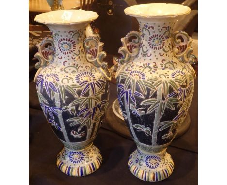 Pair of ceramic vases decorated in the Oriental style with bamboo and butterflies H: 45 cm