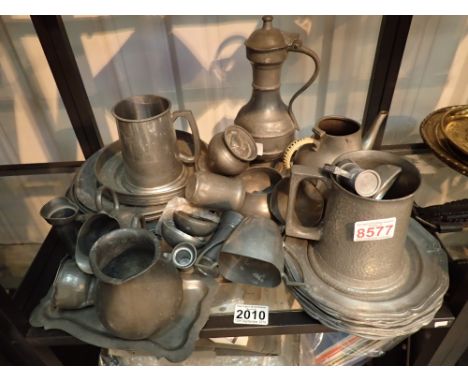 Shelf of vintage pewter items