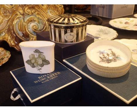Three Royal Worcester boxed items including pin dishes and lidded pots 