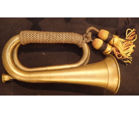 Brass bugle with cord binding and tassels