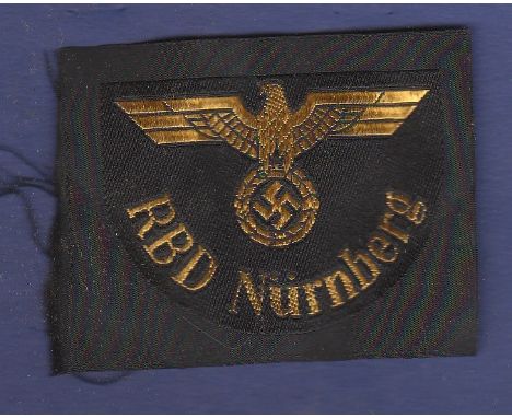 WWII German Cloth arm patch RBD Nurnberg state railway in gold braid. (Possible modern production)