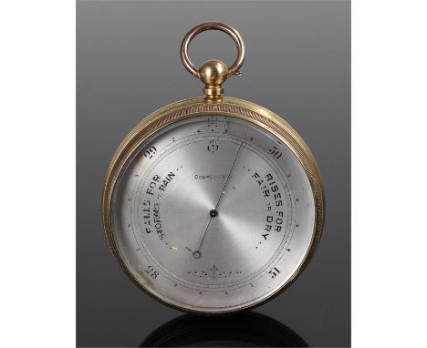 Aneroid barometer, the silvered dial with gauge, brass cased. 7cm wide