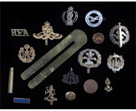A WW2 plastic economy cap badge to the Reconnaissance Corps, maker, A Stanley & Sons Walsall, two blades present, together wi