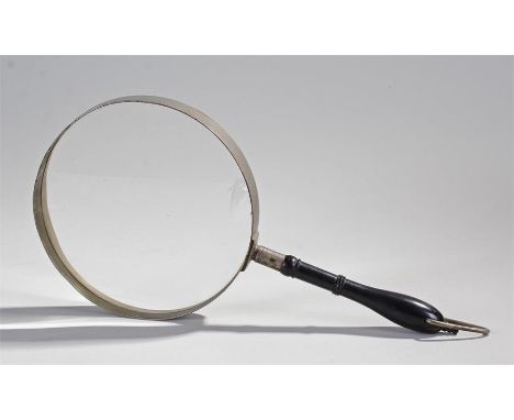 Magnifying glass of large proportions with an ebony handle. Lens diameter 20.5cm