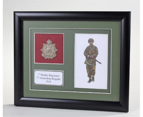 Framed print of an airborne soldier and metal cap badge to the Border Regiment commemorating the 1st Battalions involvement w