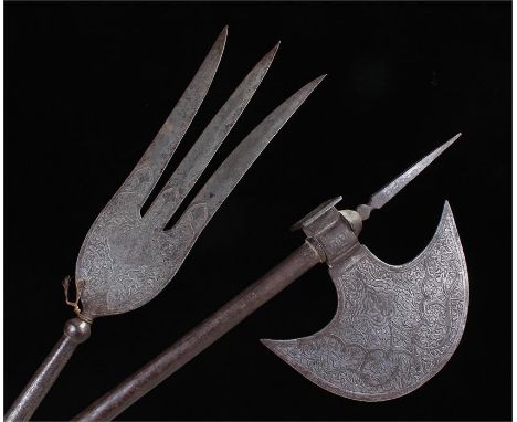 Three pronged Persian spearhead engraved with foliage and with long socket, to include a Persian steel axe with engraved blad