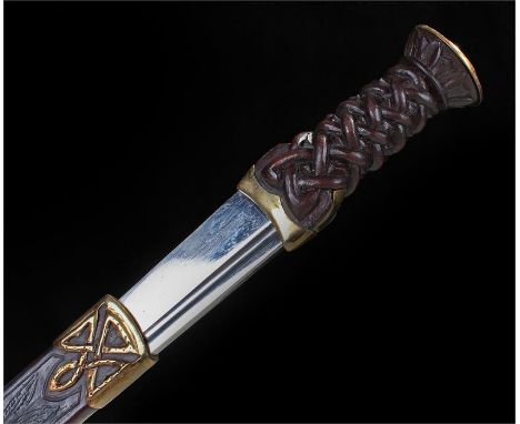 Scottish Dirk with Celtic knot grip contained in a brass mounted leather scabbard,  replica made by Highland Armoury. Blade 3