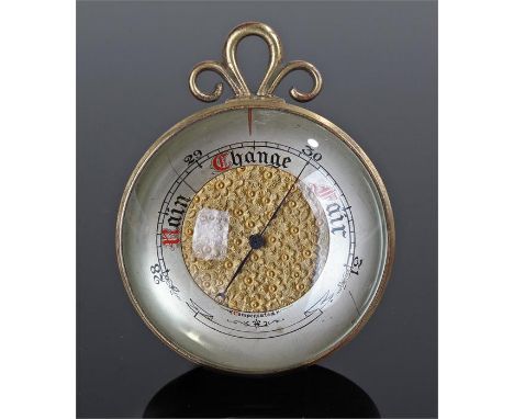 Compensated barometer, with a magnified glass enclosing the gauge, 7.5cm wide