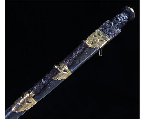 Scottish Dirk with Celtic knot grip contained in a brass mounted leather scabbard with knife and fork in the usual position r