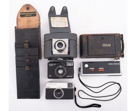 A group of various cameras , including a Kodak Vest pocket camera and an Otima 335 compact 35mm camera. 


