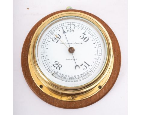 A brass bulkhead barometer, maker Kelvin Bottomley & Baird Ltd, Glasgow, the white enamel dial  signed as per title and fitte