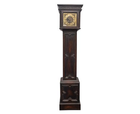 An oak cased chiming miniature longcase clock having an eight-day duration movement striking the hours and chiming the quarte