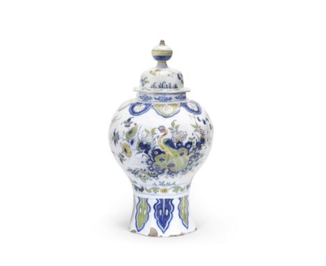 A large Dutch Delft baluster vase and cover, De Paauw factory, circa 1700Decorated in blue and green with details in red and 