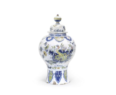 A large Dutch Delft baluster vase and cover, De Paauw factory, circa 1700Decorated in blue and green with details in red and 