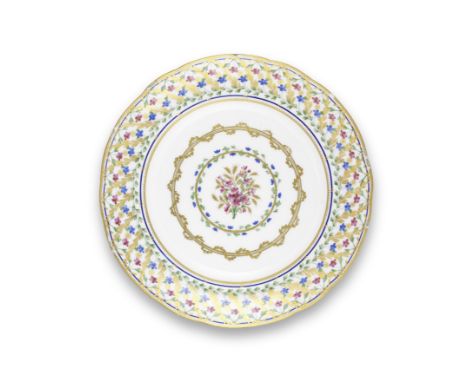 A Sèvres plate, circa 1794Painted by P.-J.-B. Vandé (fils) with a central bouquet of pink flowers and gilt wheat sheafs surro