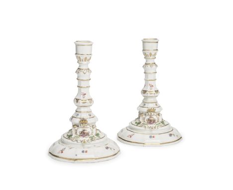 A very pair of rare Meissen candlesticks from the Sulkowski Service, circa 1735-38Each with a faceted and knopped stem painte