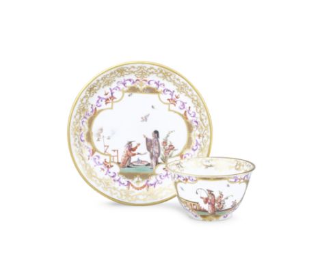 A Meissen teabowl and saucer, circa 1725-30Painted with chinoiserie scenes of figures engaged at various pursuits heightened 