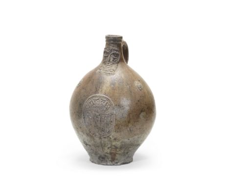 A large Cologne/Frechen stoneware armorial jug (bellarmine), first half 17th centuryWith neck-cordons and a strap handle, mou