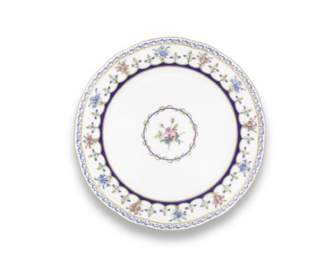 A Sèvres plate, dated 1789Painted by Mme M-J-B. Bunel with a central rose spray surrounded by a blue line heightened with gil